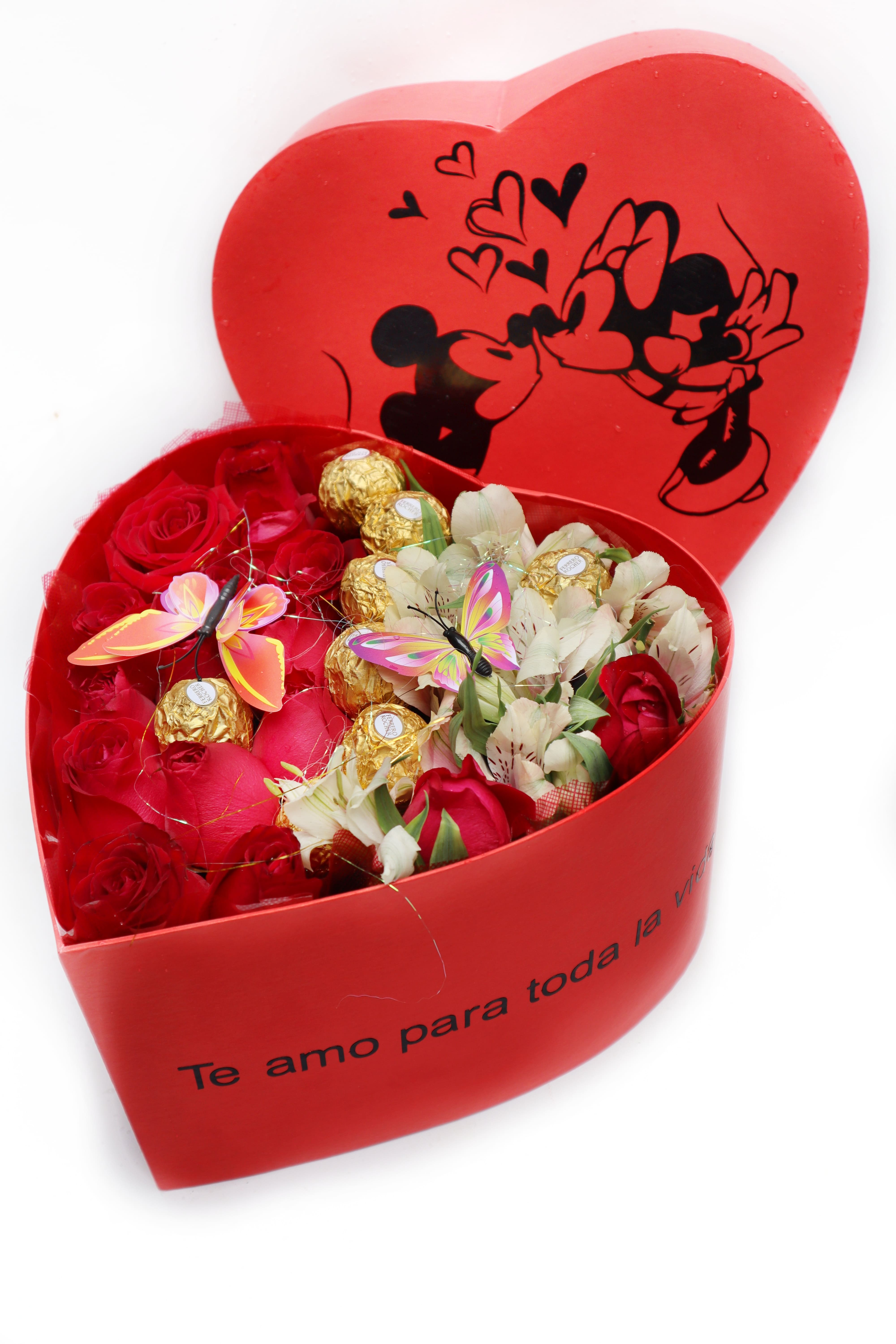 Imagen de resistiré Descripcion: Ramo de 10 rosas ferreros astromelias en caja corazon con 2 mariposas y brillos 
